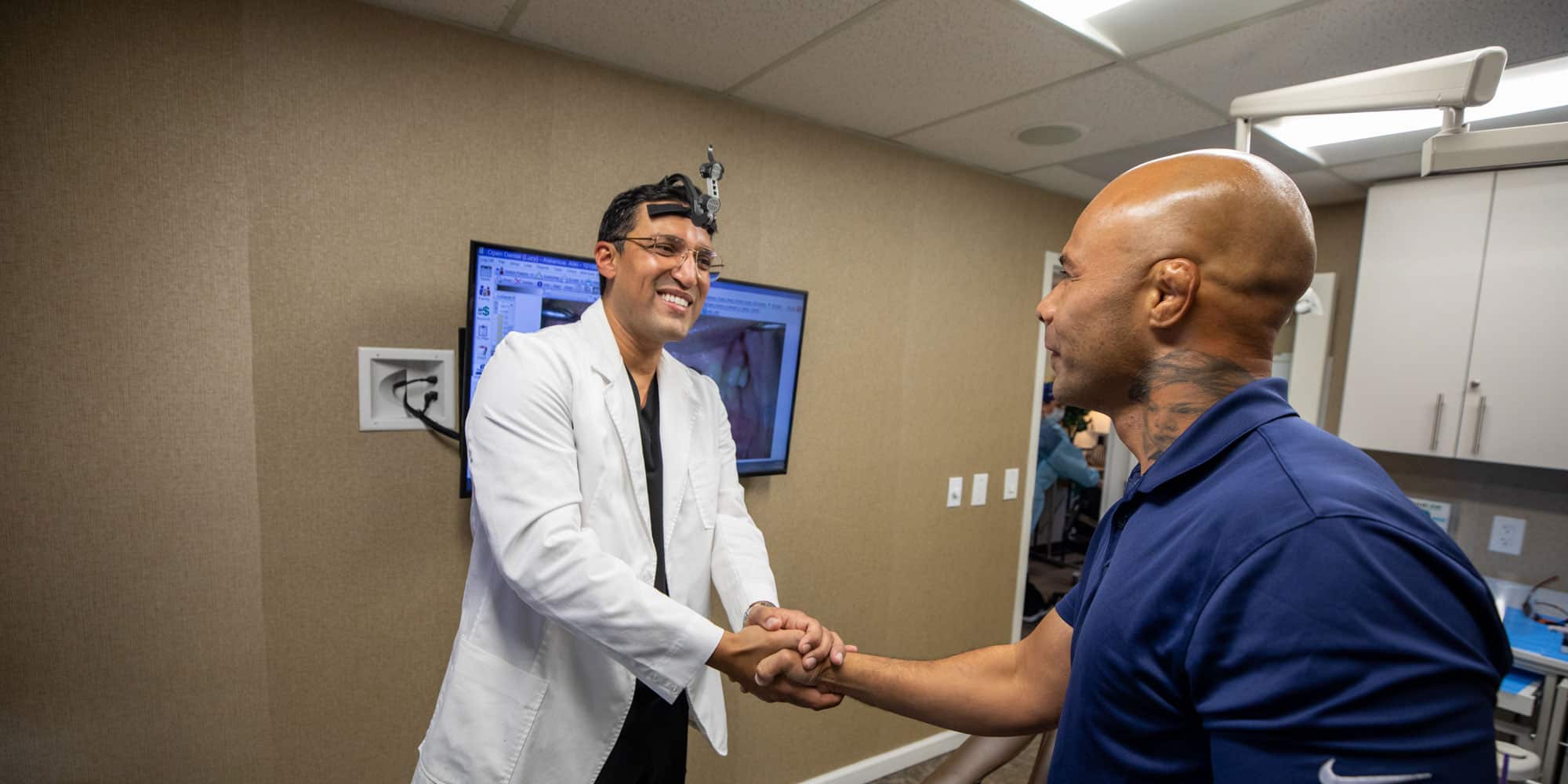 bhullar With aliki shaking hands