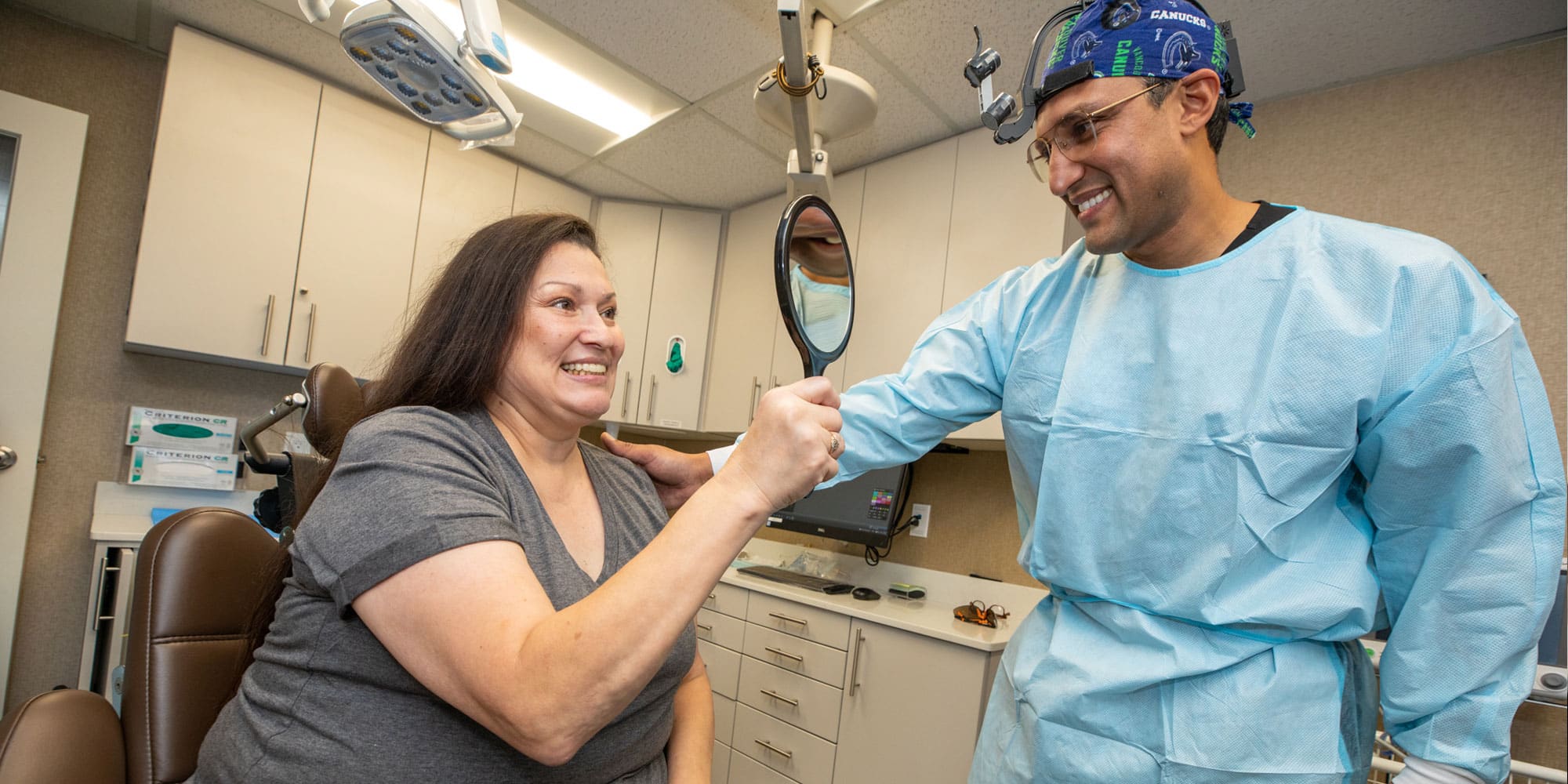 tina looking at smile makeover with the dr