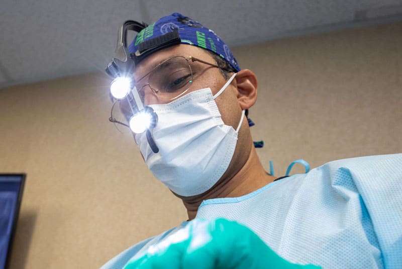 dr bhullar performning surgery